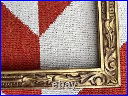 Carved Newcomb Macklin Style frame, gold and red, 21 x 15 1/8 inches