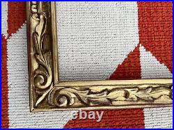Carved Newcomb Macklin Style frame, gold and red, 21 x 15 1/8 inches